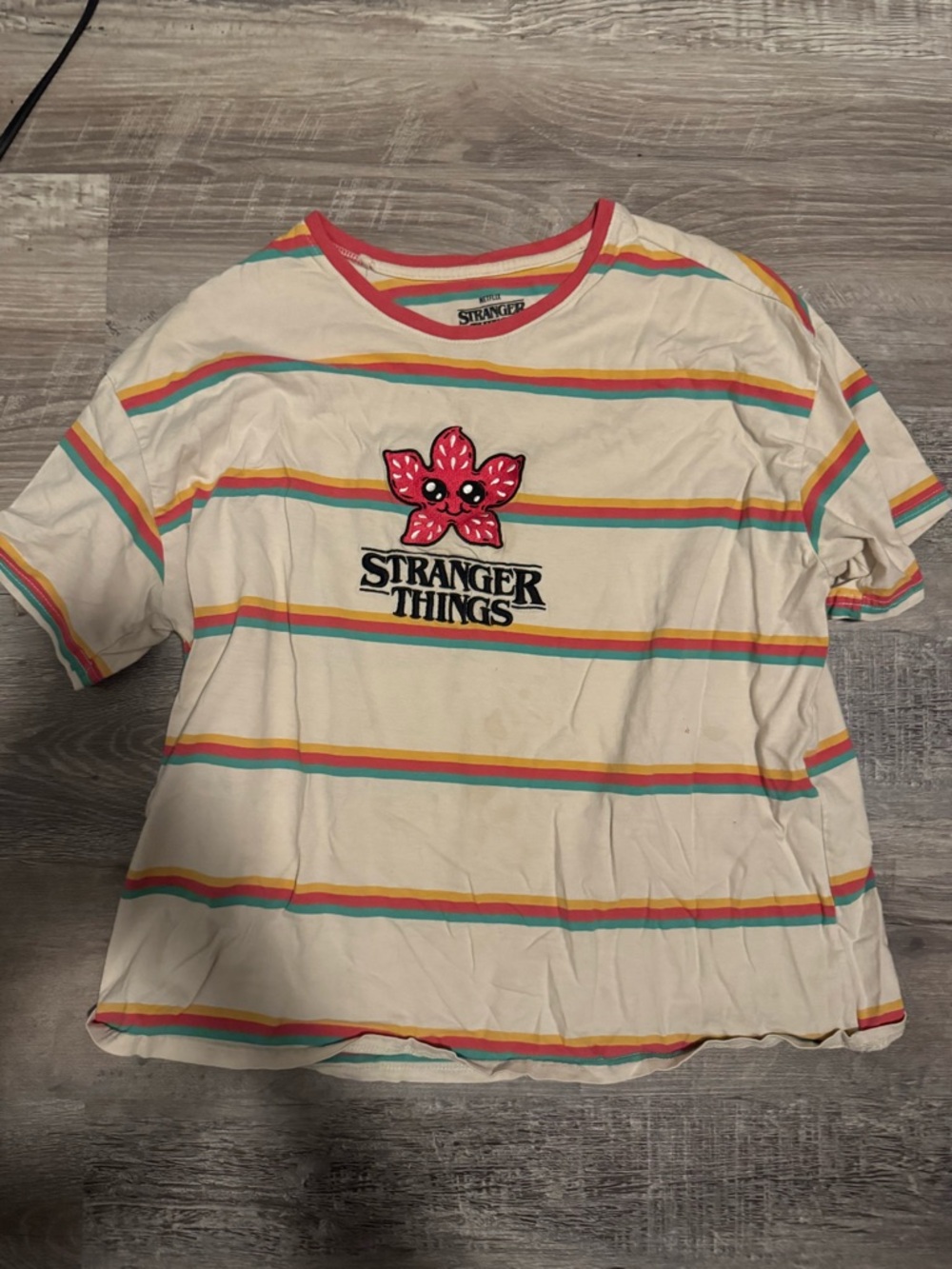 Netflix Cream Short Sleeve Tee with Pink Demogorgon and Multicolor Stripes